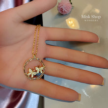سنسال فراشتين داخل إطار دائري مرصع زركون مطلي ذهب عيار 21 من Misk Shop