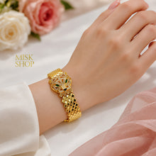 Cartier-inspired tiger head bracelet worn on wrist
