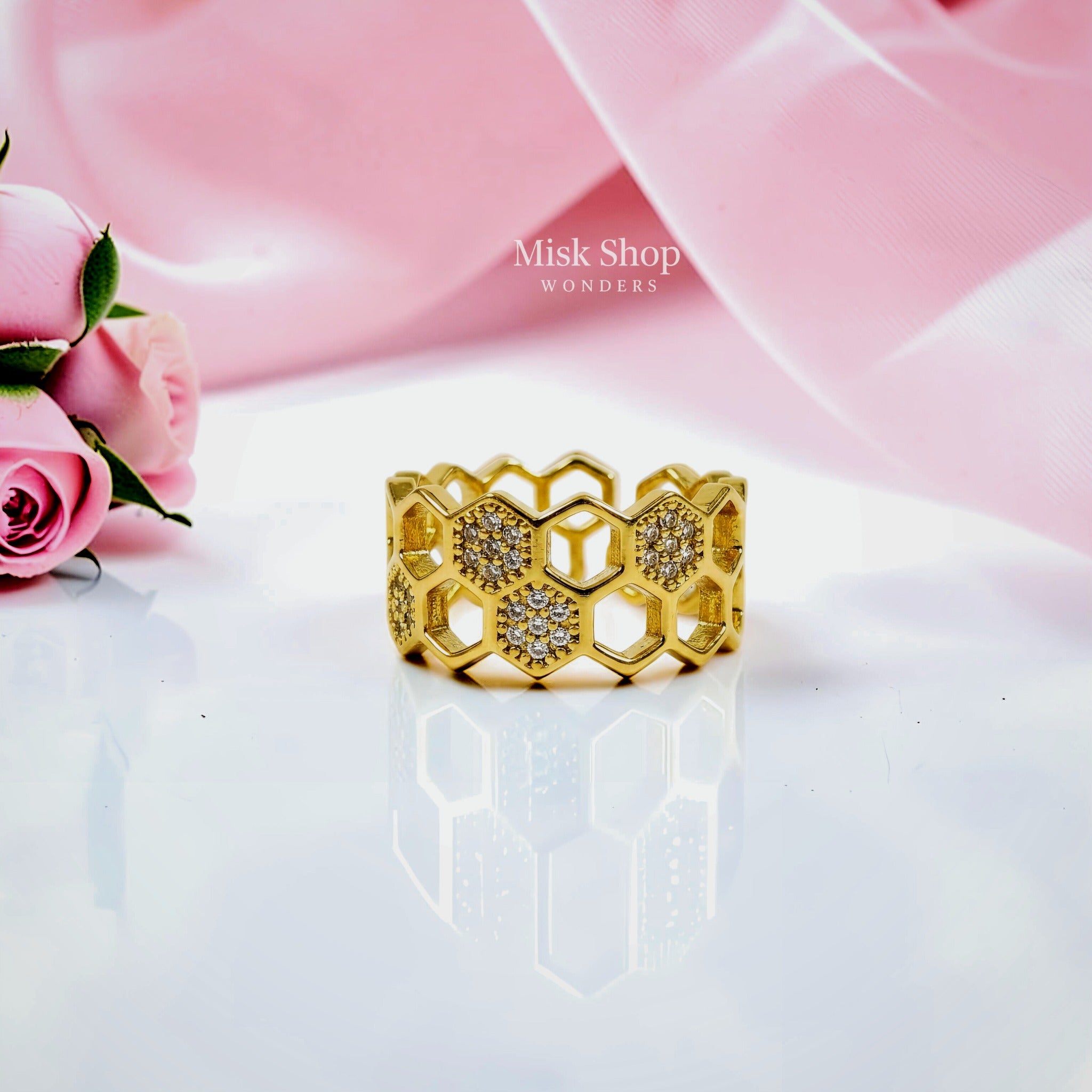 Gold-tone honeycomb open ring with clear stone accents