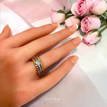 Triple-band two-tone zirconia ring shown on hand