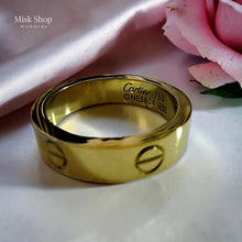 Classic gold love inspired ring with signature engravings and luxury polished finish by Misk Shop