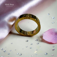 Classic gold love inspired ring with signature engravings and luxury polished finish by Misk Shop