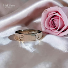 Classic silver love inspired ring plated with white gold and platinum featuring signature engravings by Misk Shop