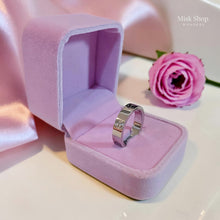 Classic silver love inspired ring plated with white gold and platinum featuring signature engravings by Misk Shop