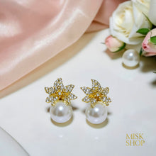 Matching floral zircon stud earrings with cultured pearl drops