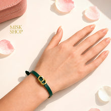 Green CD link leather bracelet worn on wrist