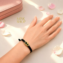 Black CD link leather bracelet worn on wrist