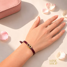 Burgundy CD link leather bracelet worn on wrist