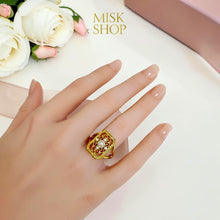 Floral pearl statement ring worn on hand