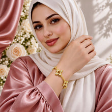 Gold floral zircon bracelet styled on a model