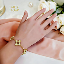Gold floral zircon bracelet worn on the wrist