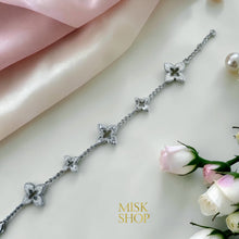 Silver floral zircon bracelet laid flat