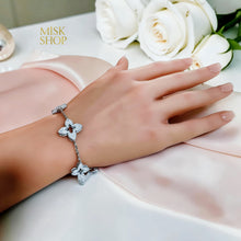 Silver floral zircon bracelet worn on the wrist