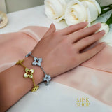 Gold and silver floral zircon bracelets shown on the wrist