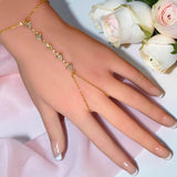 Geometric triangle zircon hand chain bracelet in gold tone worn on hand