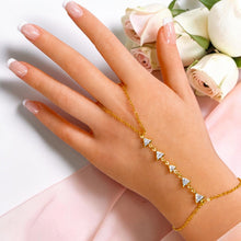 Lifestyle view of geometric triangle zircon hand chain bracelet worn on hand