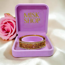Misk Shop Surah Al-Ikhlas stainless steel bracelet with zircon detailing displayed inside a pink jewelry box