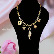 
Luxury gold plated charm necklace featuring a zircon wing, star charm, decorative medallions and premium 5A zircon stones by Misk Shop
