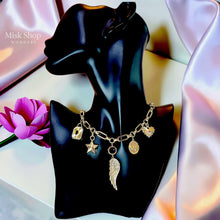 
Luxury gold plated charm necklace featuring a zircon wing, star charm, decorative medallions and premium 5A zircon stones by Misk Shop