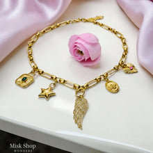Luxury gold plated charm necklace featuring a zircon wing, star charm, decorative medallions and premium 5A zircon stones by Misk Shop