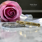 Crystal-studded bangle in gold and silver 18K-plated finishes by Misk Shop