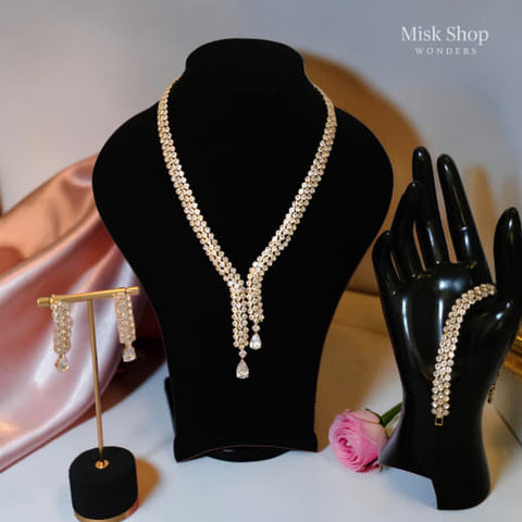Luxury gold zircon jewelry set with long necklace, earrings, and bracelet for bridal and elegant formal occasions