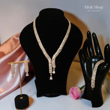 Luxury gold zircon jewelry set with long necklace, earrings, and bracelet for bridal and elegant formal occasions