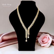 Luxury gold zircon jewelry set with long necklace, earrings, and bracelet for bridal and elegant formal occasions