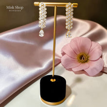Luxury gold zircon jewelry set with long necklace, earrings, and bracelet for bridal and elegant formal occasions