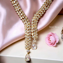 Luxury gold zircon jewelry set with long necklace, earrings, and bracelet for bridal and elegant formal occasions