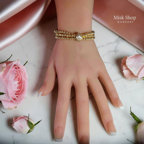 Luxury triple bubble ball bracelet with three gold bead strands and a sparkling zircon clasp, 18K gold plated for women by Misk Shop.