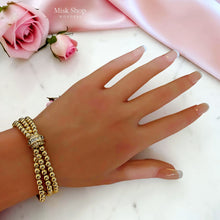 Luxury triple bubble ball bracelet with three gold bead strands and a sparkling zircon clasp, 18K gold plated for women by Misk Shop.