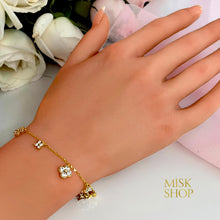 Delicate gold-plated zircon flower bracelet worn on the wrist