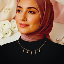 Gold-plated marquise zircon drop choker styled with a modest black outfit