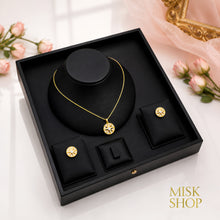 Compass star necklace and earrings displayed in a presentation box