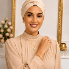 Compass star necklace and earrings on a model; bracelet shown for styling only