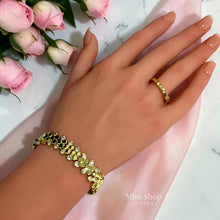 Chaumet-inspired flexible honeycomb bracelet worn on the wrist; ring not included