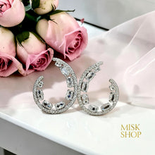 Silver open teardrop earrings detail