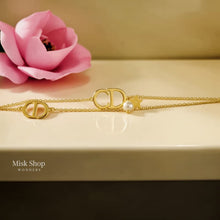 Gold plated CD bracelet with pearl and star charm from Misk Shop
