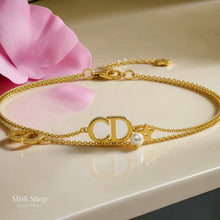 Gold plated CD bracelet with pearl and star charm from Misk Shop