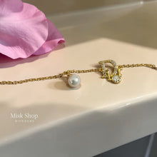Gold plated letter D bracelet with pearl and zircon from Misk Shop