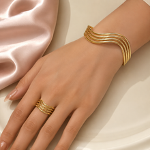 18K gold plated modern wave bracelet and free-size ring set styled on hand from Misk Shop