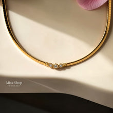 Gold plated snake chain choker necklace with zircon stones from Misk Shop
