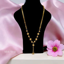 Luxury gold jewelry set with necklace, bracelet, and dangling earrings by Misk Shop