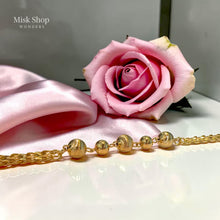 Luxury gold jewelry set with necklace, bracelet, and dangling earrings by Misk Shop