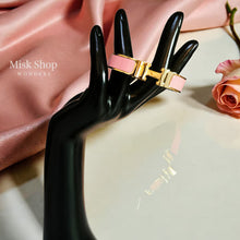 Wide gold plated H style bangle available in six colors from Misk Shop
