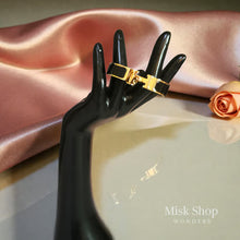 Wide gold plated H style bangle available in six colors from Misk Shop
