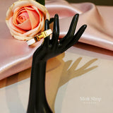 Wide gold plated H style bangle available in six colors from Misk Shop
