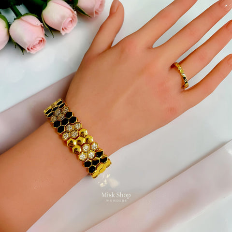 Wide 21K gold plated honeycomb zircon bracelet worn on the wrist; ring not included