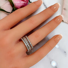 Silver open free-size zirconia ring worn on hand